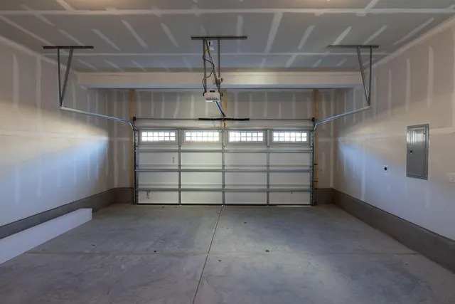 a living room with fireplace furniture and a large window