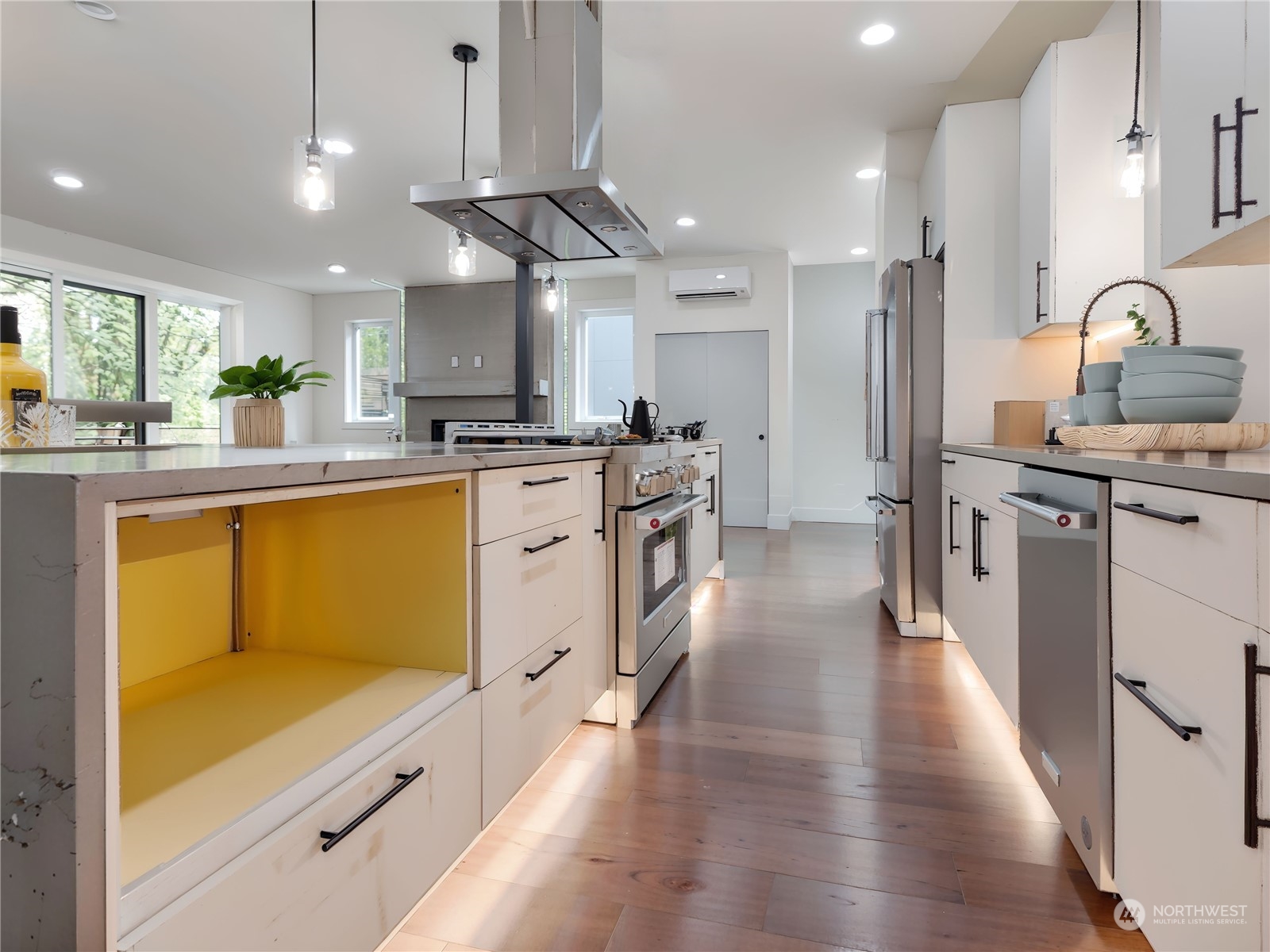 407 Southwest Thistle Street Seattle, WA 98106 - Photo 12 of 40 a kitchen with stainless steel appliances granite countertop sink stove top oven and refrigerator
