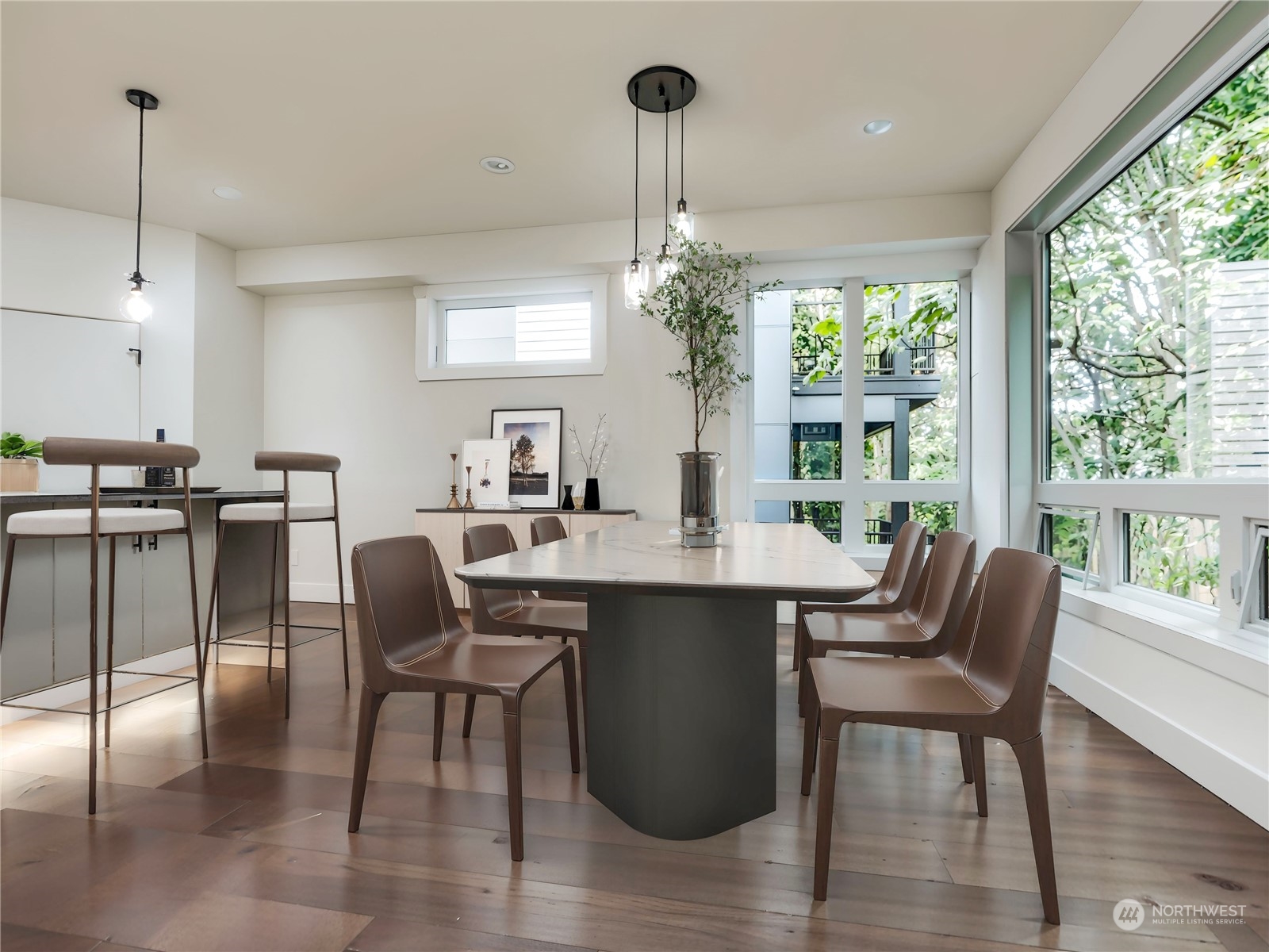 407 Southwest Thistle Street Seattle, WA 98106 - Photo 13 of 40 a dining room with furniture a chandelier and wooden floor