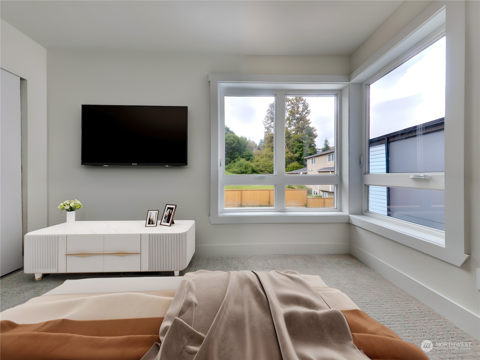 407 Southwest Thistle Street Seattle, WA 98106 - Photo 16 of 40 a spacious bedroom with a bed and a flat screen tv