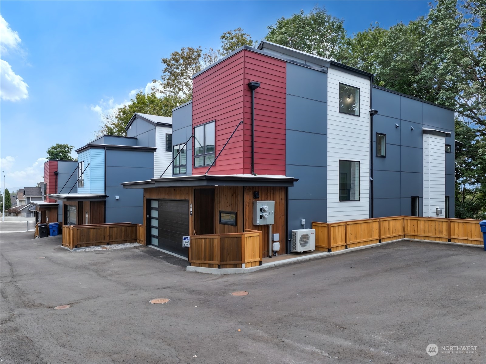 407 Southwest Thistle Street Seattle, WA 98106 - Photo 2 of 40 a view of a house with a barbeque and large trees
