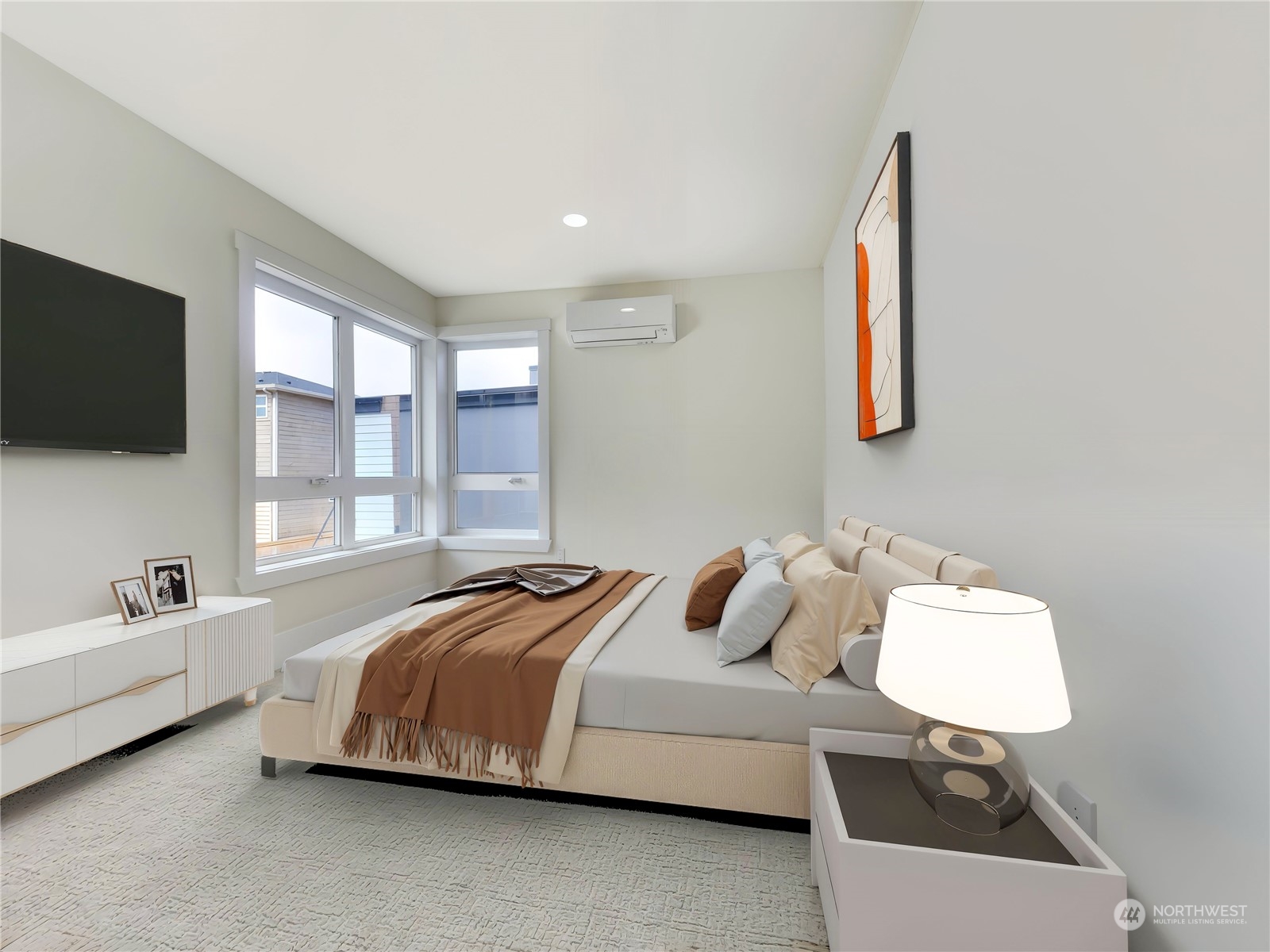 407 Southwest Thistle Street Seattle, WA 98106 - Photo 21 of 40 a bedroom with a bed and a flat screen tv