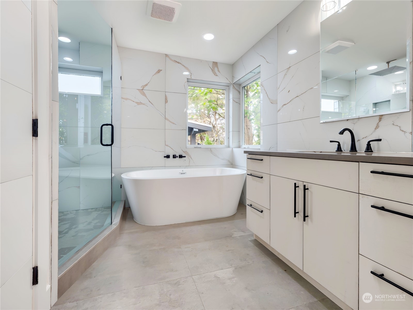 407 Southwest Thistle Street Seattle, WA 98106 - Photo 23 of 40 a white bath tub sitting next to a bathroom sink