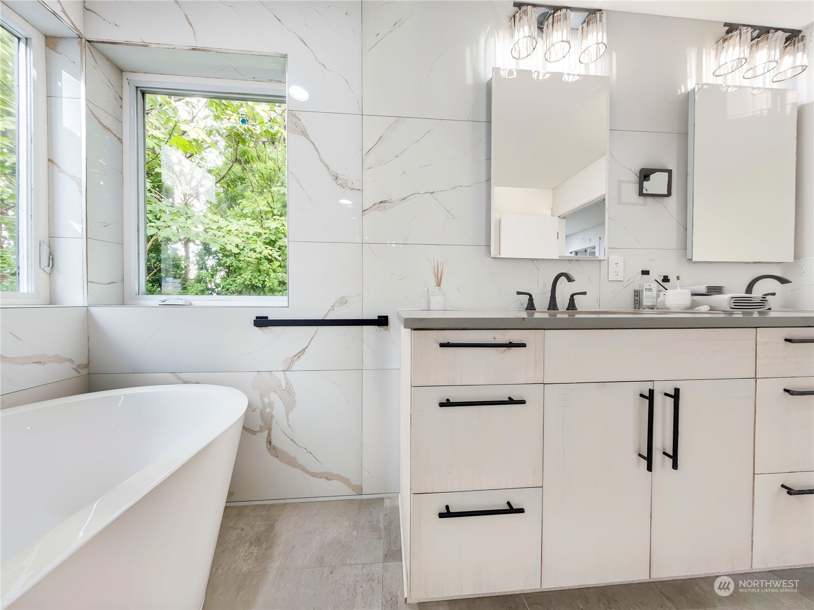 407 Southwest Thistle Street Seattle, WA 98106 - Photo 24 of 40 a bathroom with a sink and a mirror