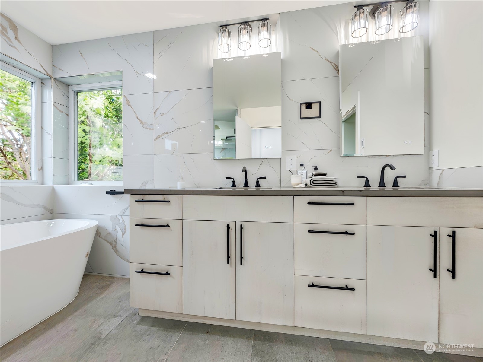 407 Southwest Thistle Street Seattle, WA 98106 - Photo 25 of 40 a white kitchen with white cabinets and sink