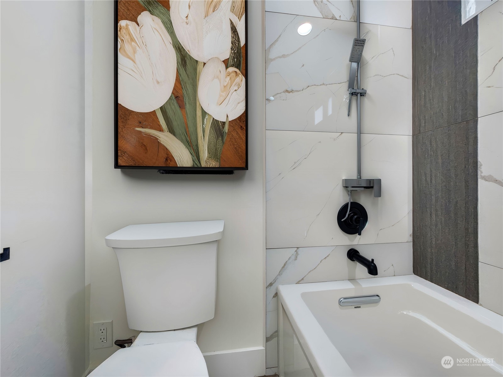 407 Southwest Thistle Street Seattle, WA 98106 - Photo 27 of 40 a bathroom with a toilet sink and mirror