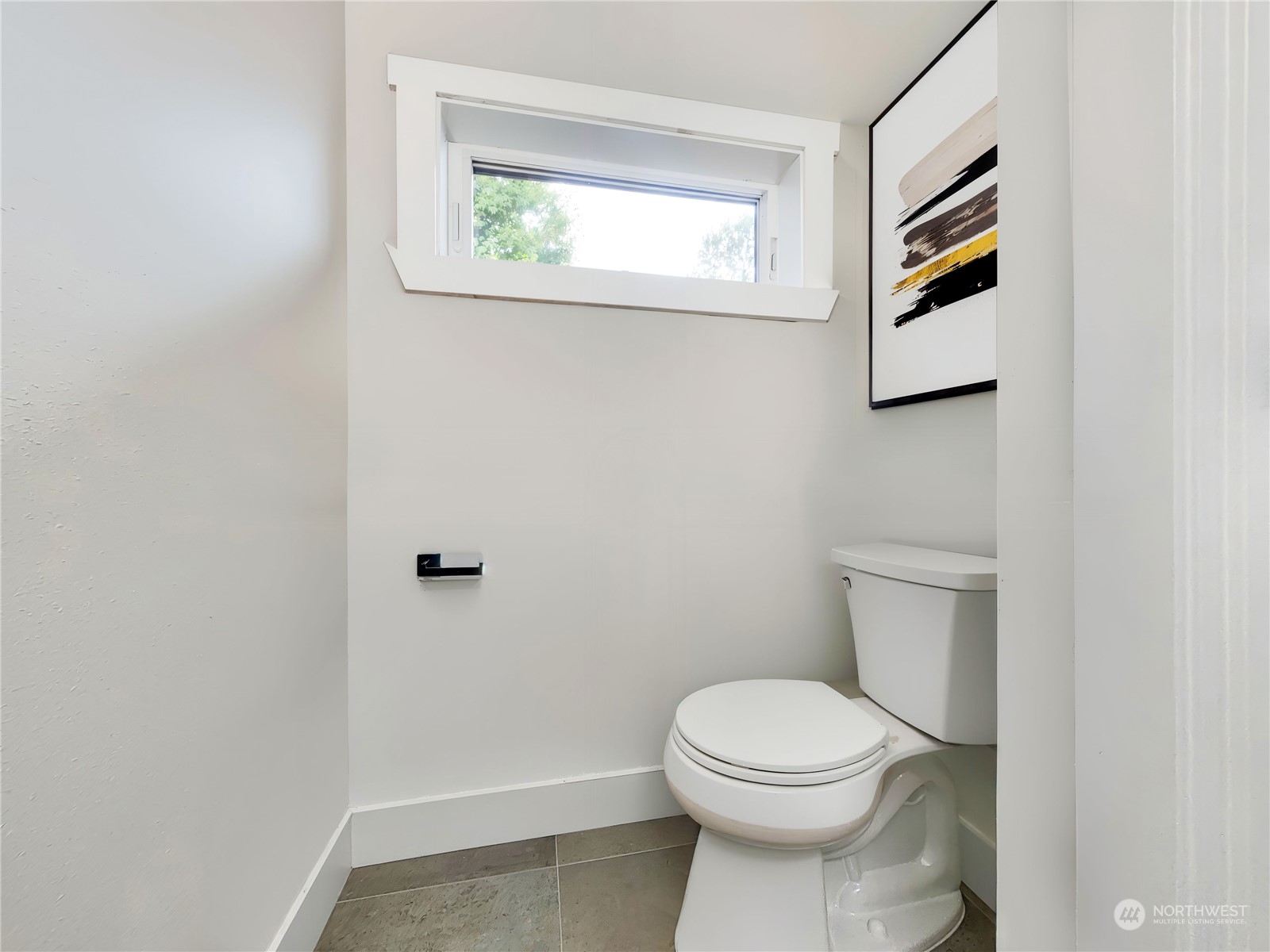 407 Southwest Thistle Street Seattle, WA 98106 - Photo 28 of 40 a bathroom with a toilet and a window