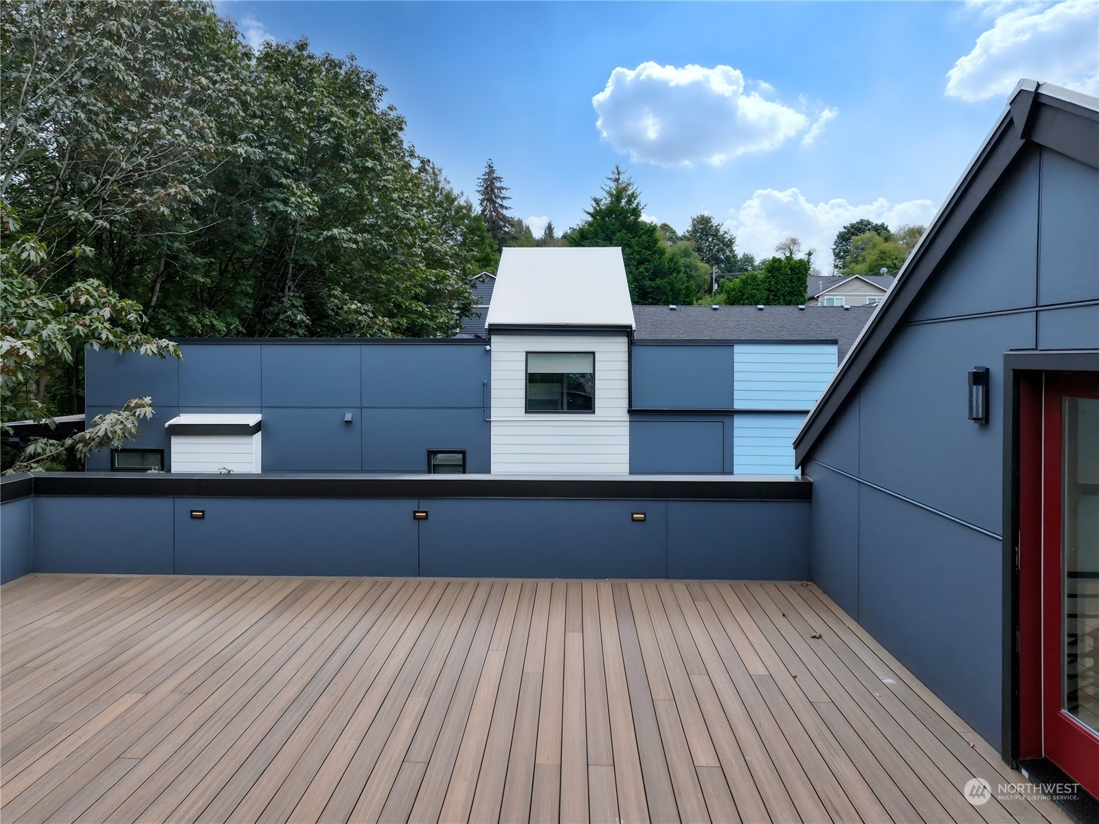 407 Southwest Thistle Street Seattle, WA 98106 - Photo 36 of 40 a view of a terrace hall with wooden floor and fence