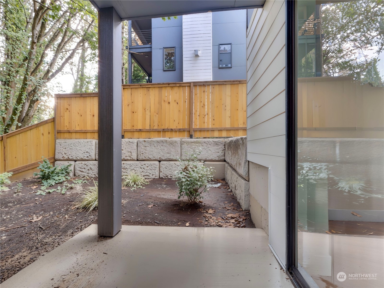 407 Southwest Thistle Street Seattle, WA 98106 - Photo 39 of 40 a view of a porch with a potted plant