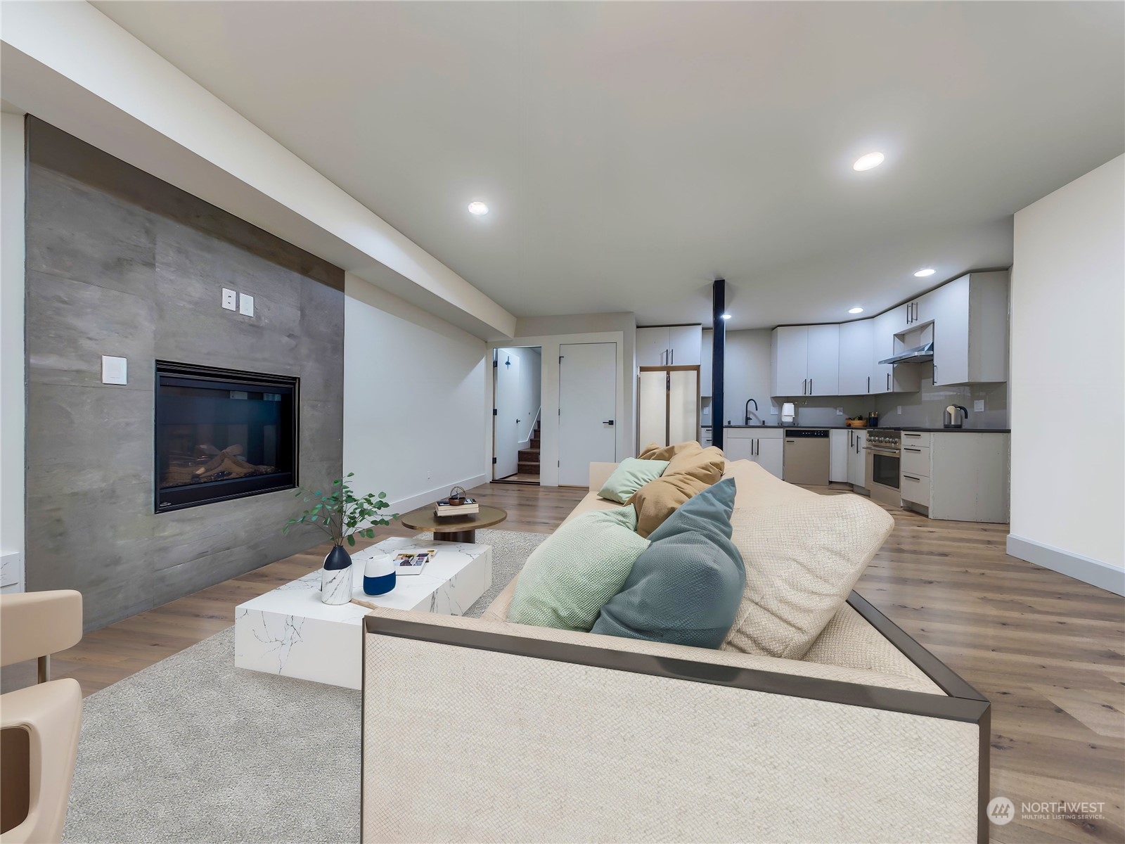 407 Southwest Thistle Street Seattle, WA 98106 - Photo 9 of 40 a living room with furniture and a flat screen tv