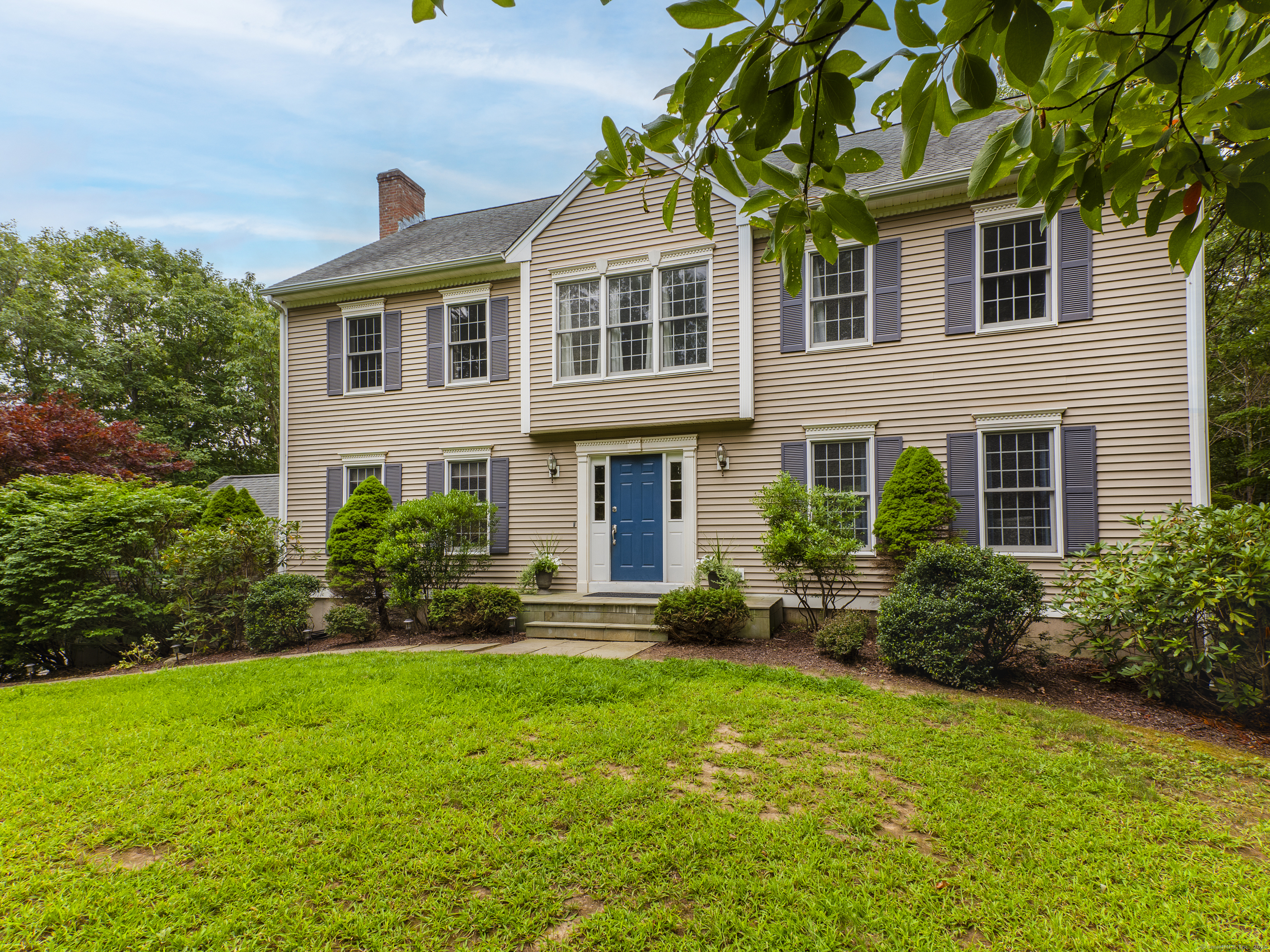 a front view of a house with a yard