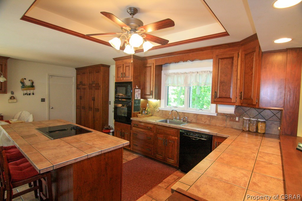 1472 Laurel Point Road Lancaster, VA 22503 - Photo 11 of 40 a large kitchen with a table and chairs