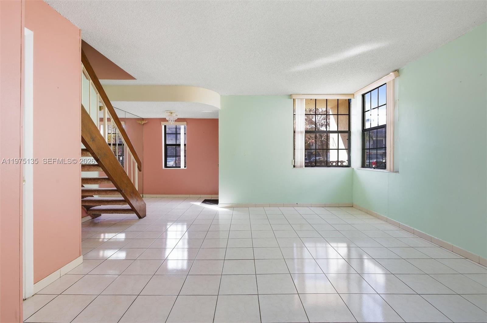 12253 Southwest 16th Terrace, Unit 108M Miami, FL 33175 - Photo 12 of 50 a view of an empty room with windows