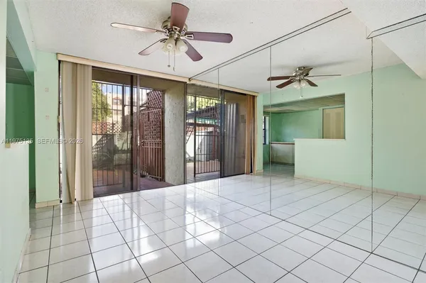a spacious bathroom with a mirror and a shower