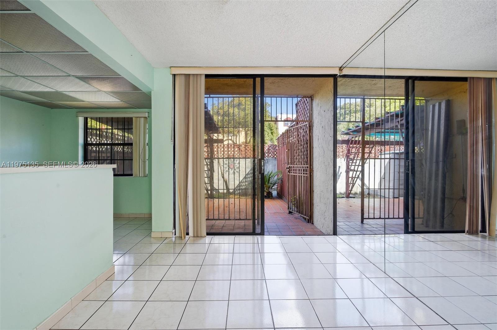 12253 Southwest 16th Terrace, Unit 108M Miami, FL 33175 - Photo 14 of 50 a view of a entrance door of the room