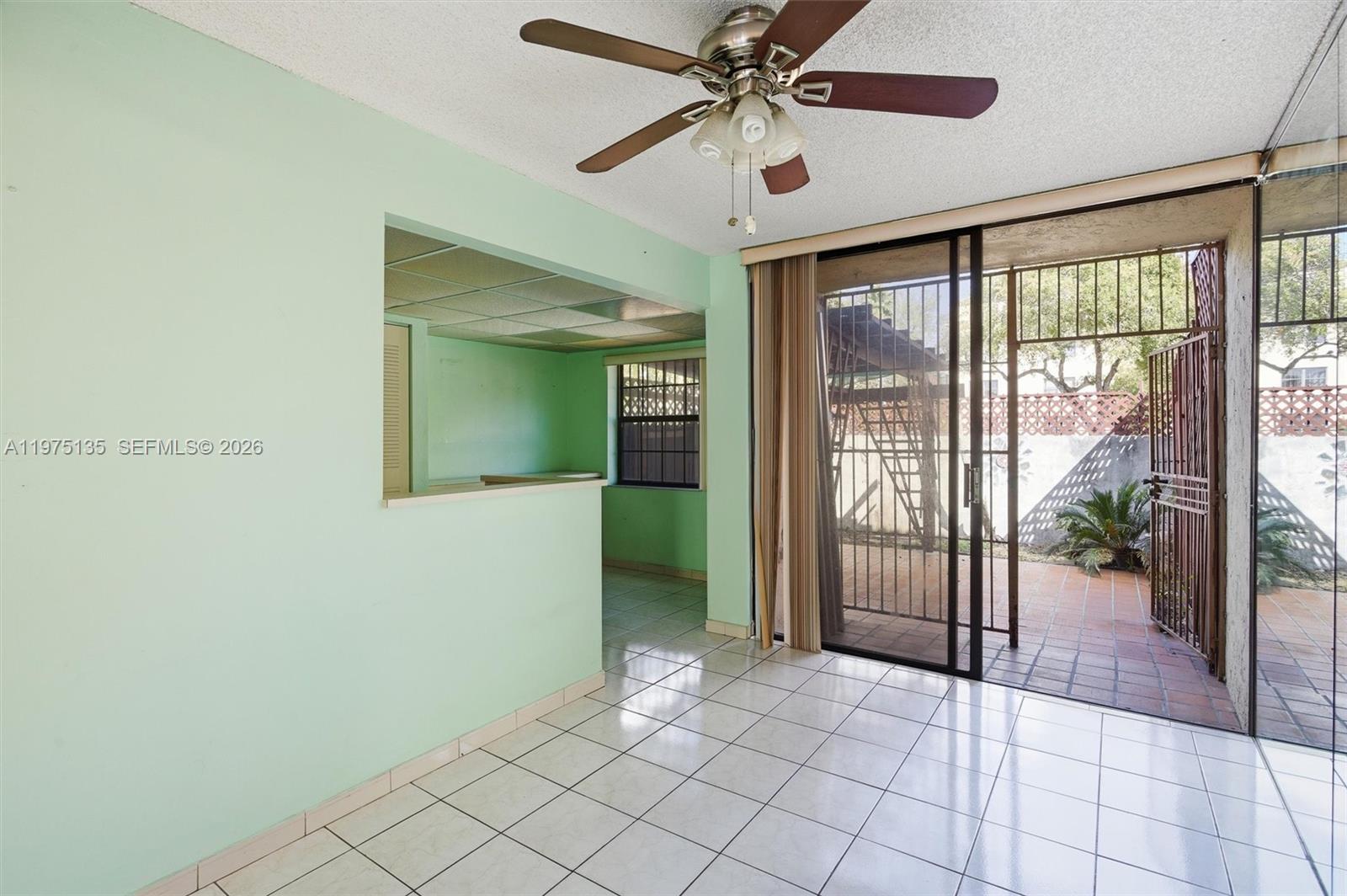 12253 Southwest 16th Terrace, Unit 108M Miami, FL 33175 - Photo 15 of 50 a view of an entryway with a chandelier fan