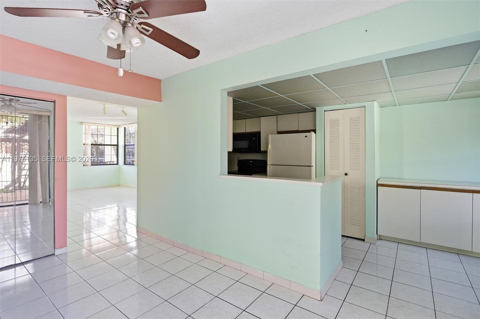 12253 Southwest 16th Terrace, Unit 108M Miami, FL 33175 - Photo 16 of 50 a view of an entryway with a chandelier fan