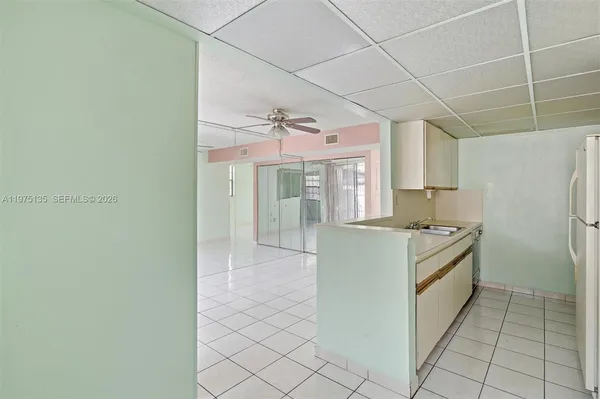 a kitchen with a cabinets and a stove top oven
