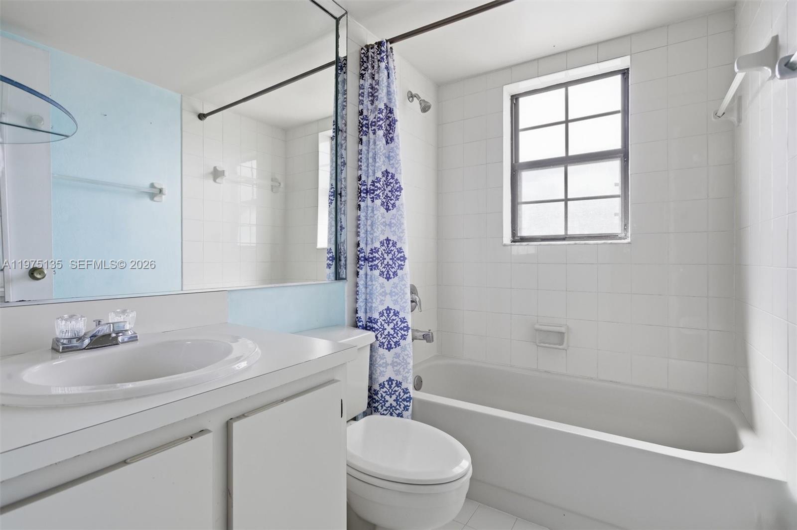 12253 Southwest 16th Terrace, Unit 108M Miami, FL 33175 - Photo 23 of 50 a bathroom with a sink a toilet and a bathtub