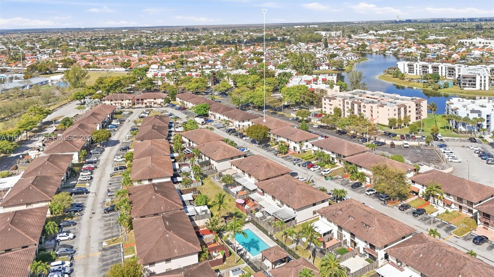 12253 Southwest 16th Terrace, Unit 108M Miami, FL 33175 - Photo 39 of 50 an aerial view of residential building with green space