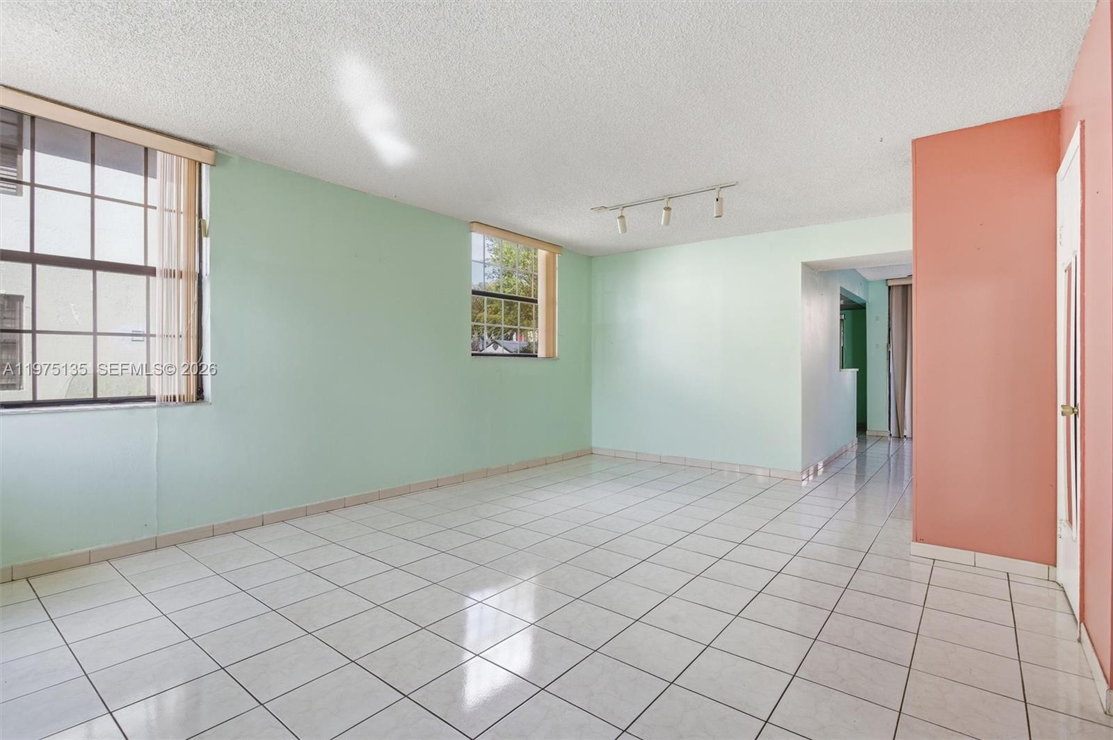 12253 Southwest 16th Terrace, Unit 108M Miami, FL 33175 - Photo 9 of 50 a view of an empty room with window