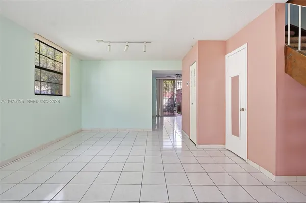 a view of an empty room and window