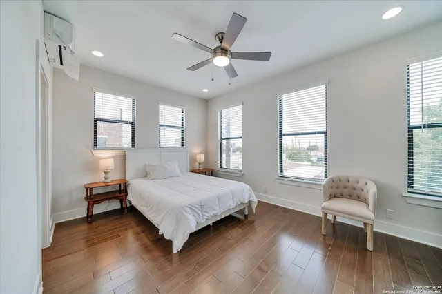 a bedroom with a bed and window