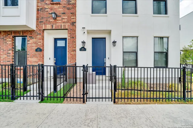 a view of a house with a fence