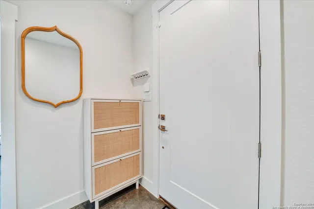 a living room with furniture and windows