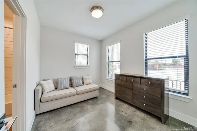 a view of livingroom with furniture and window