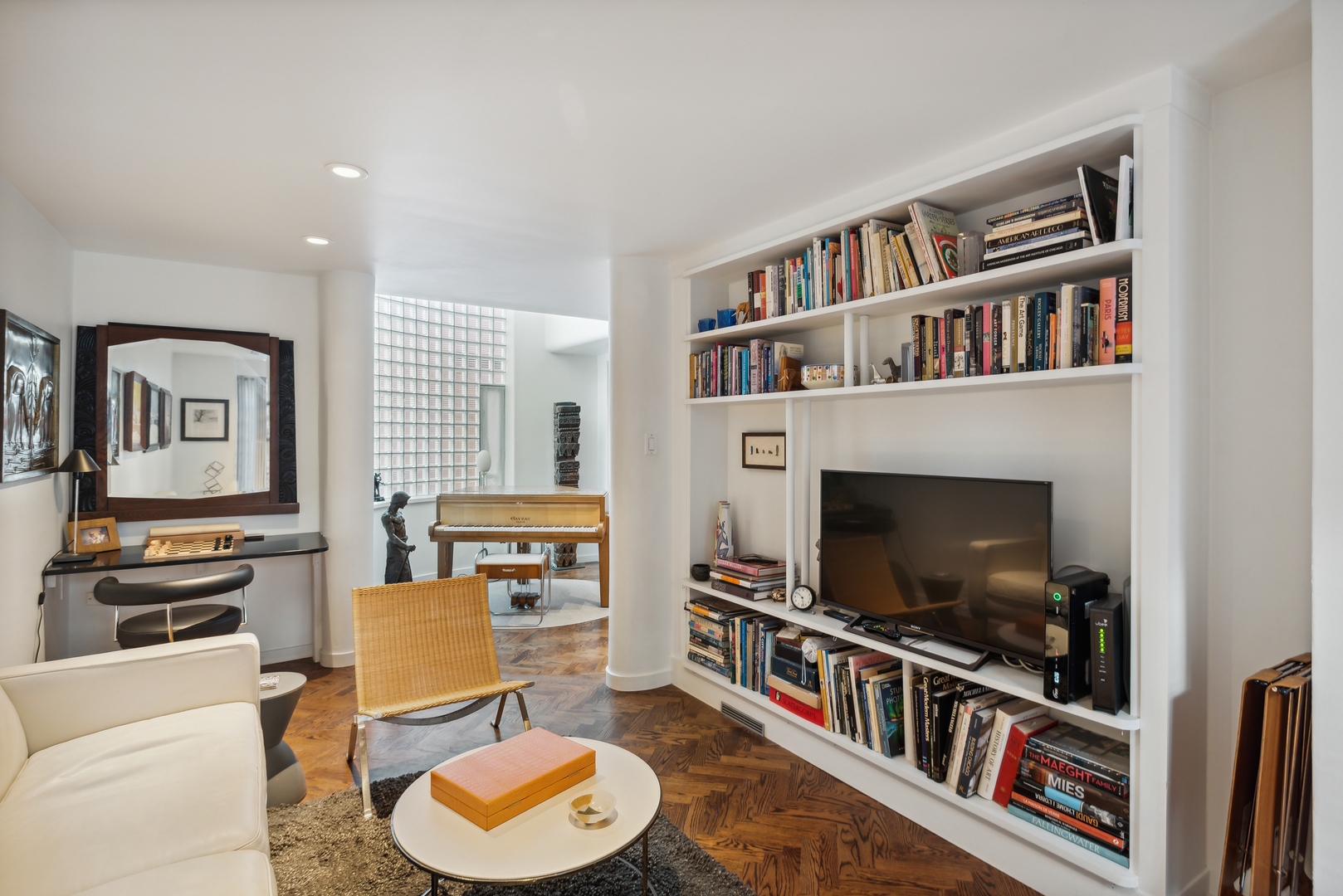 1209 North State Parkway, Unit 13 Chicago, IL 60610 - Photo 14 of 37 a living room with furniture and a flat screen tv