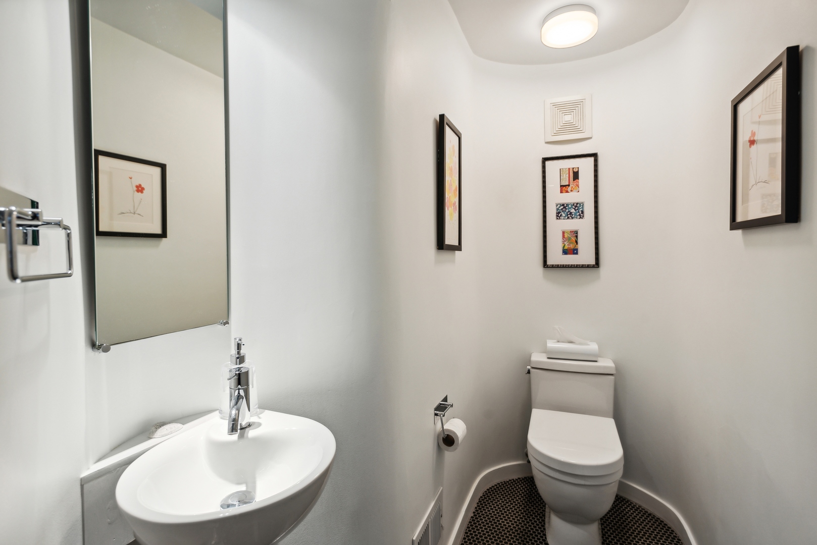 1209 North State Parkway, Unit 13 Chicago, IL 60610 - Photo 15 of 37 a bathroom with a toilet sink and mirror