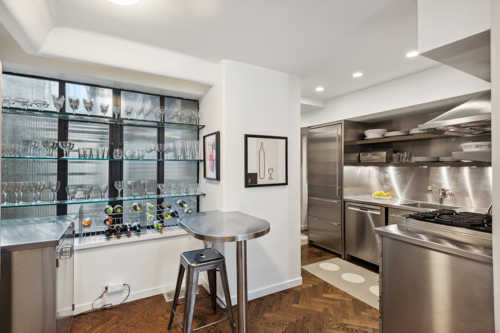 1209 North State Parkway, Unit 13 Chicago, IL 60610 - Photo 16 of 37 a kitchen with counter top space and stainless steel appliances