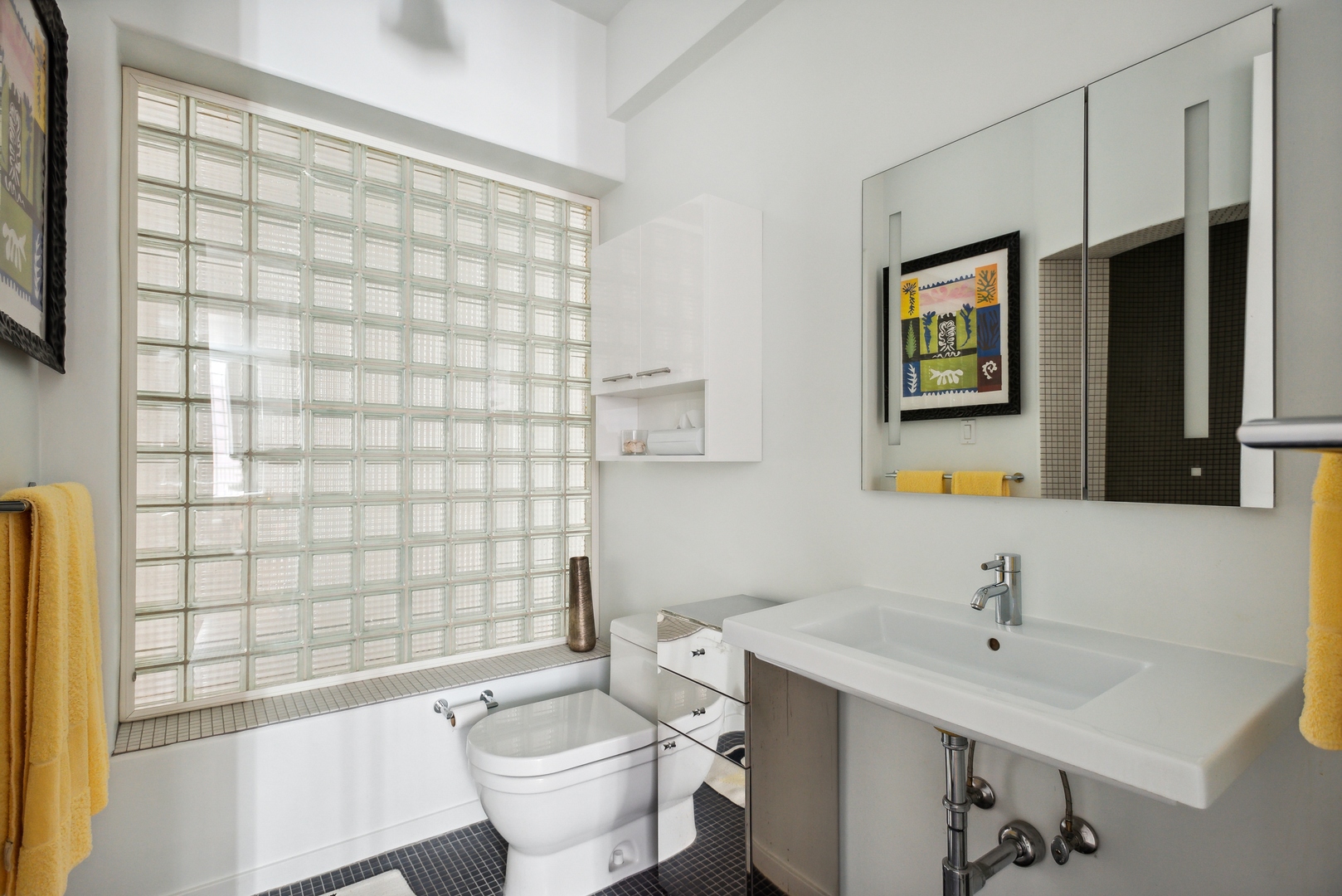1209 North State Parkway, Unit 13 Chicago, IL 60610 - Photo 21 of 37 a bathroom with a sink toilet and shower