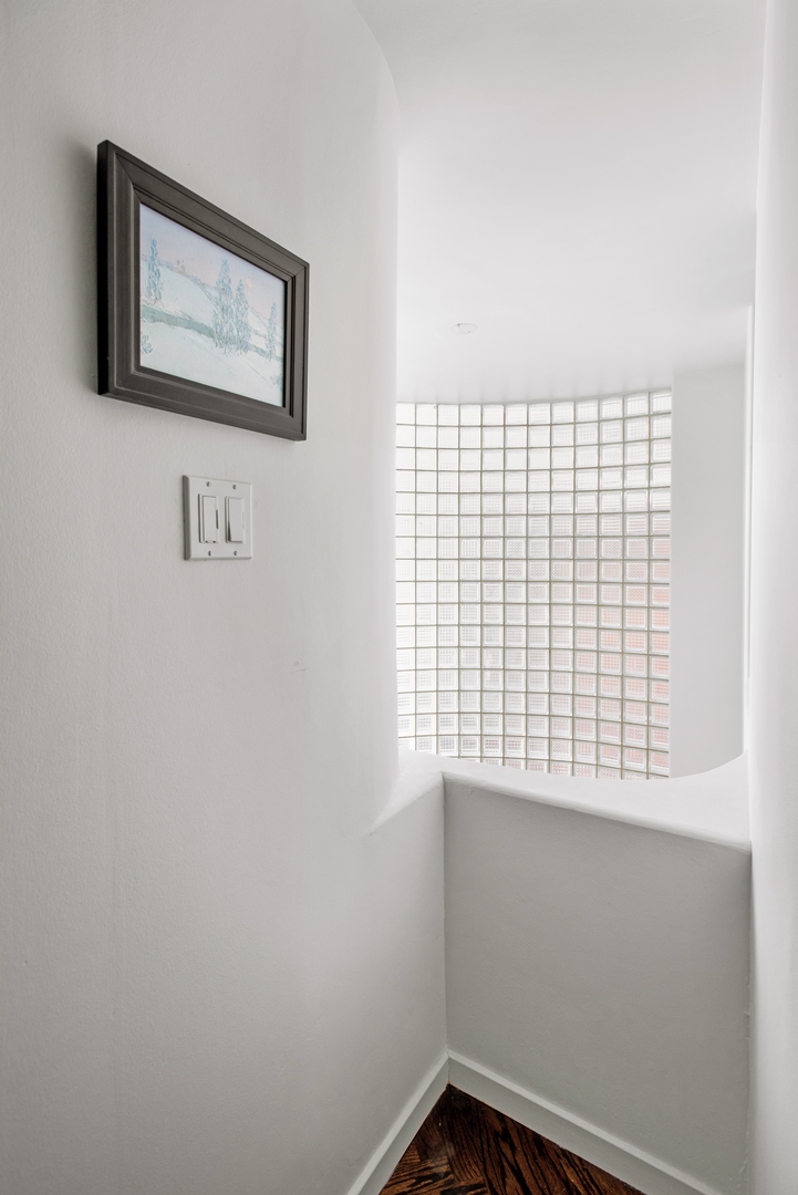 1209 North State Parkway, Unit 13 Chicago, IL 60610 - Photo 25 of 37 a view of a small space with racks on the wall