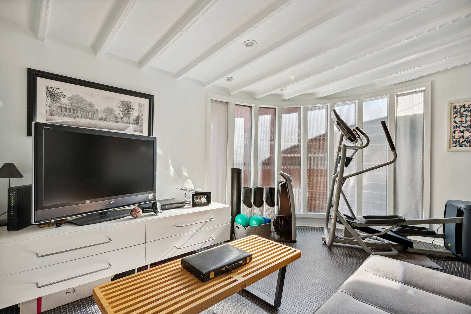 1209 North State Parkway, Unit 13 Chicago, IL 60610 - Photo 29 of 37 a living room with furniture and a flat screen tv