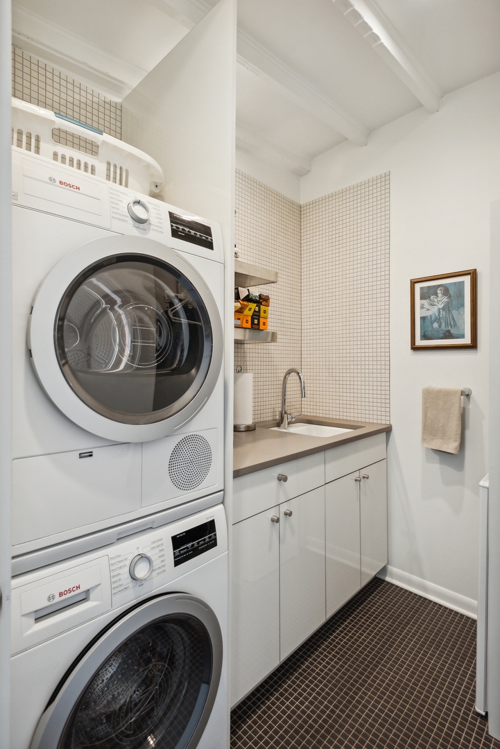 1209 North State Parkway, Unit 13 Chicago, IL 60610 - Photo 31 of 37 a utility room with sink dryer and washer