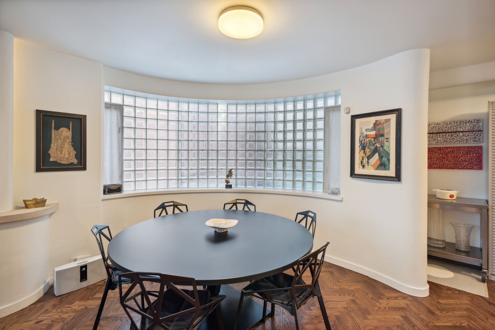 1209 North State Parkway, Unit 13 Chicago, IL 60610 - Photo 10 of 37 a view of a dining room with furniture and wooden floor
