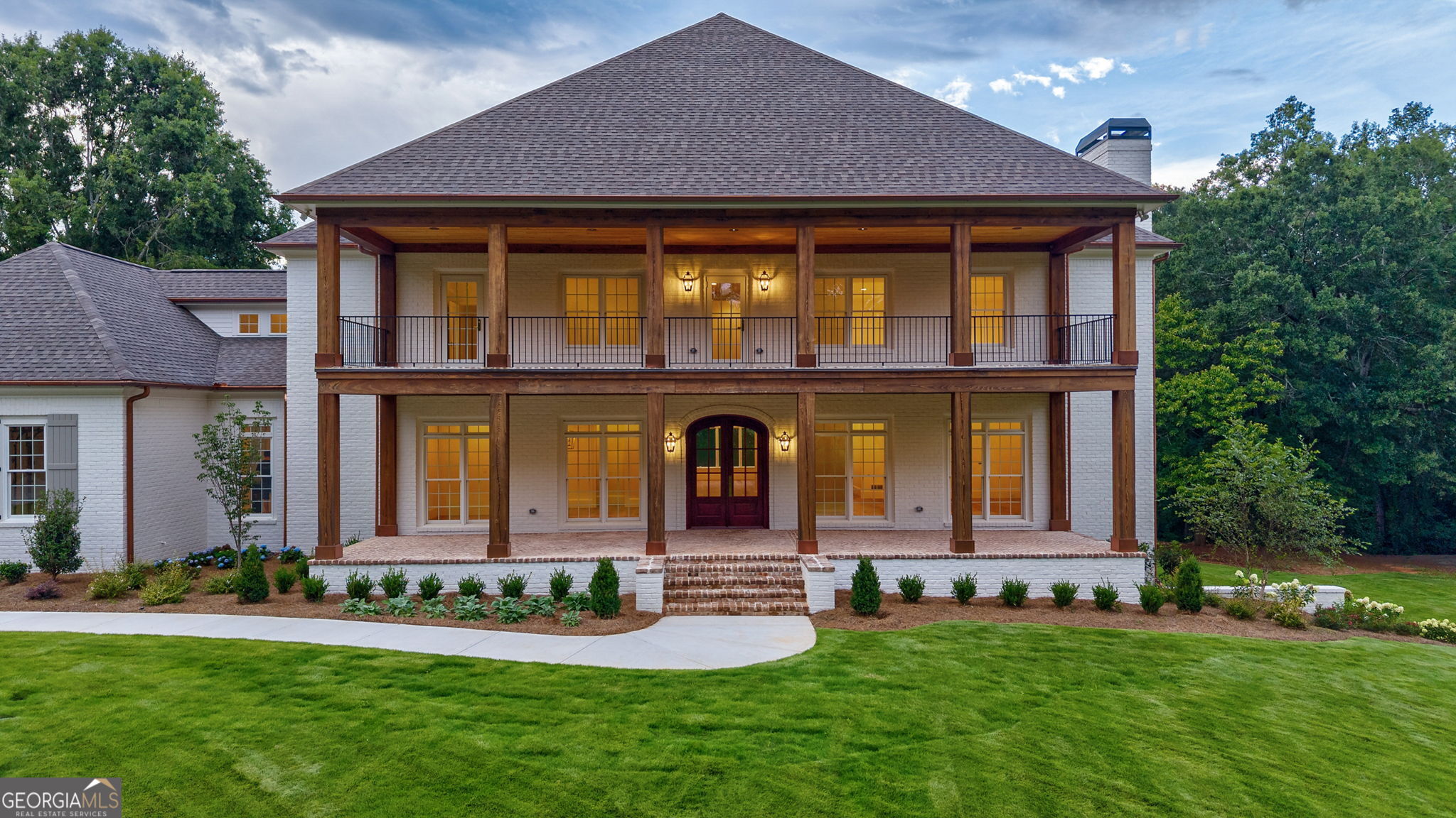 1321 Garrett Road Statham, GA 30666 - Photo 139 of 161 a front view of a house with a garden and yard