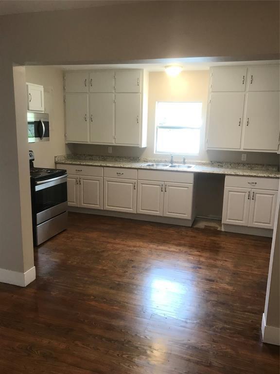 Kitchen includes a Stove, Microwave, Dishwasher (added since photo was taken) and Refrigerator.