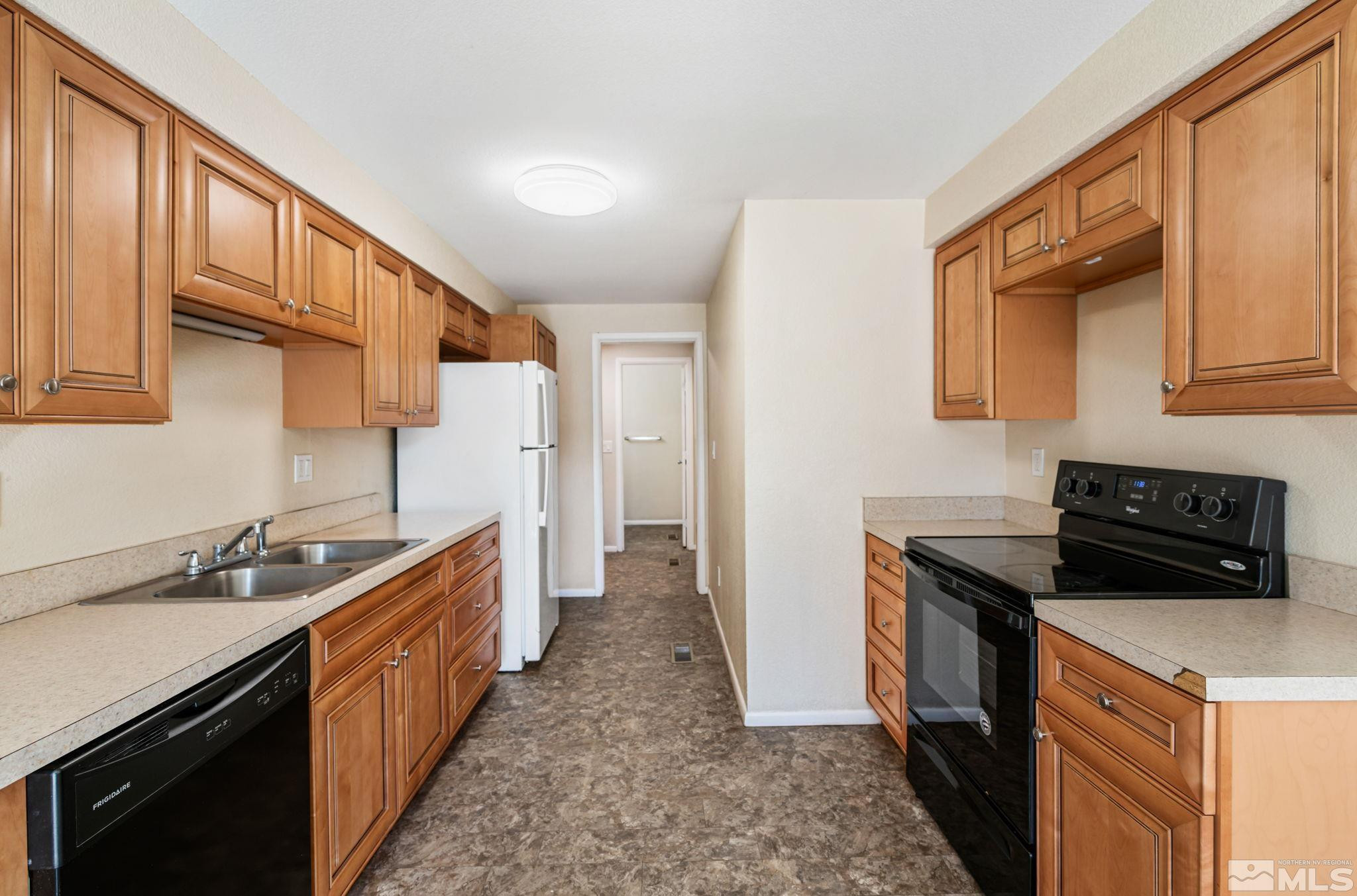 3924 Pheasant Drive Carson City, NV 89701 - Photo 20 of 38 a kitchen with a sink stove and refrigerator