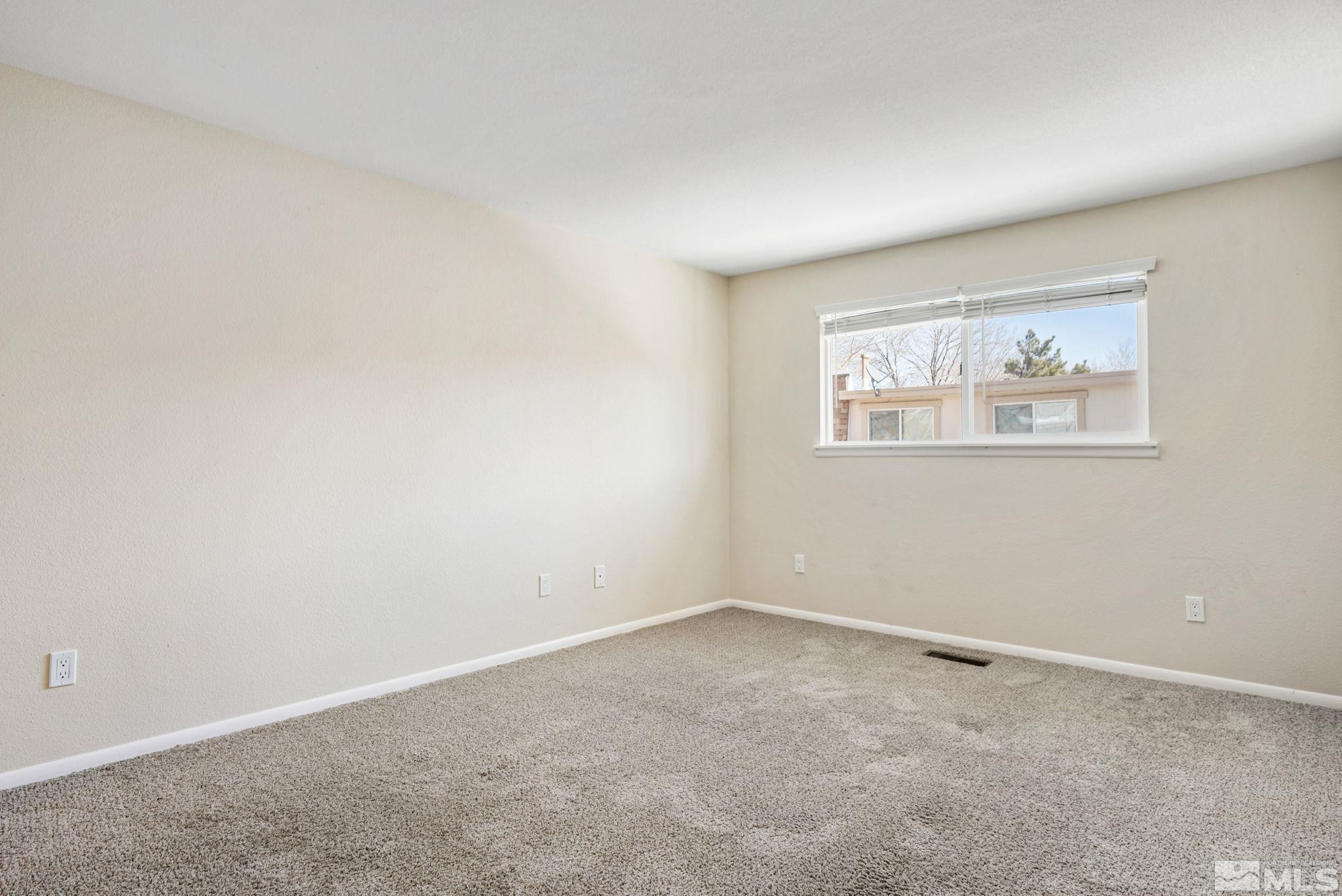 3924 Pheasant Drive Carson City, NV 89701 - Photo 27 of 38 an empty room with windows