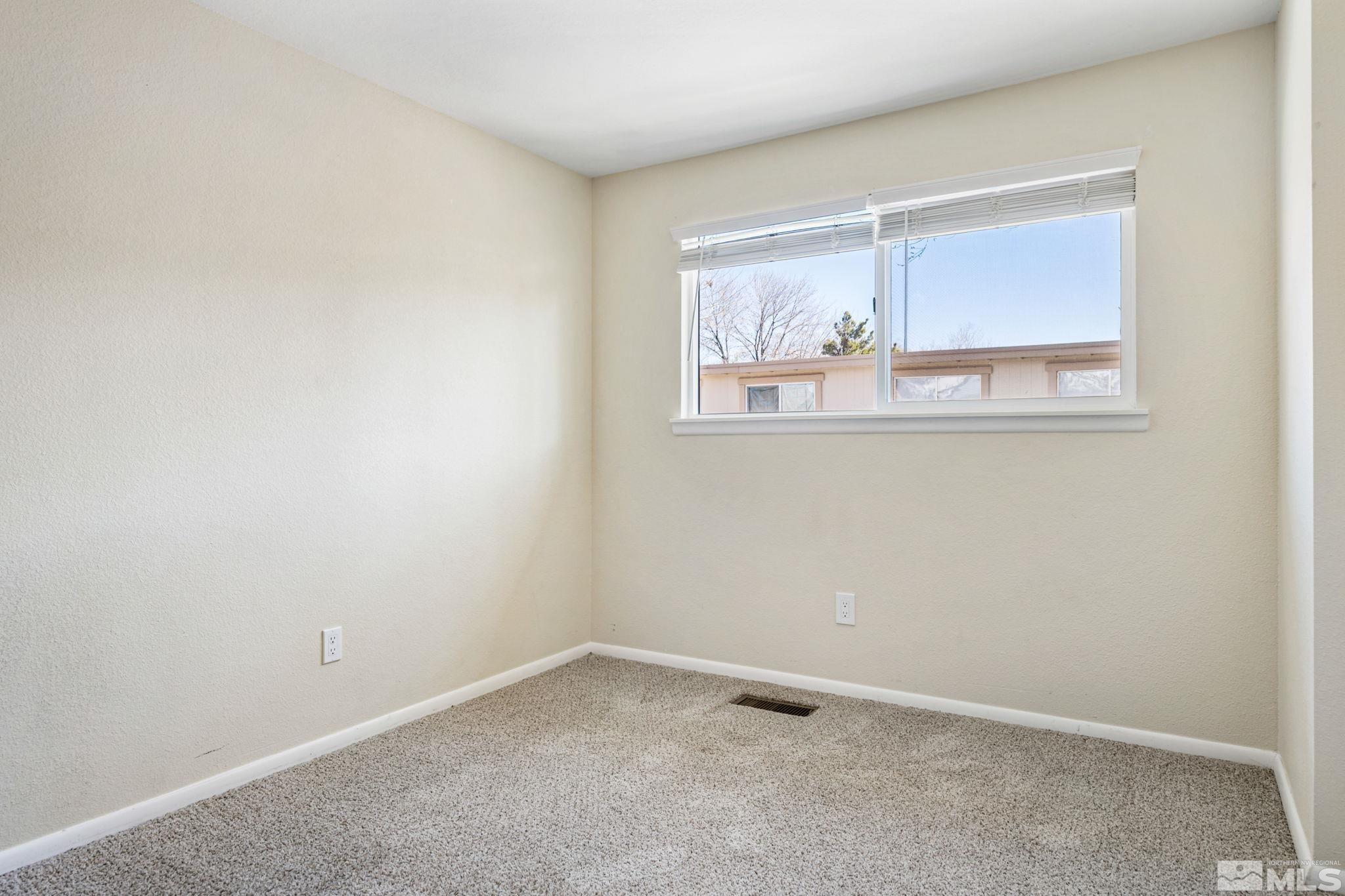 3924 Pheasant Drive Carson City, NV 89701 - Photo 31 of 38 an empty room with a window