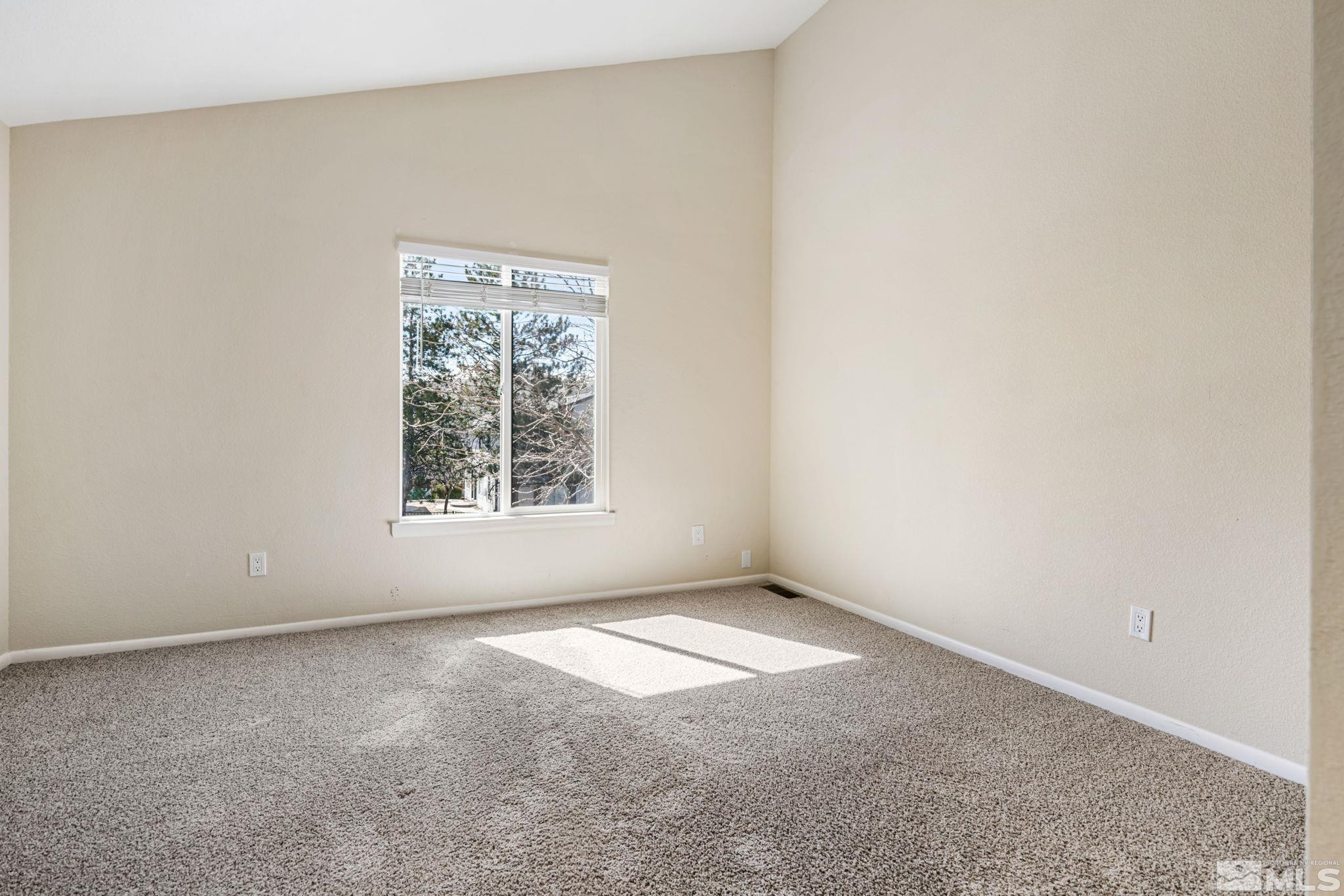 3924 Pheasant Drive Carson City, NV 89701 - Photo 33 of 38 a view of an empty room with a window