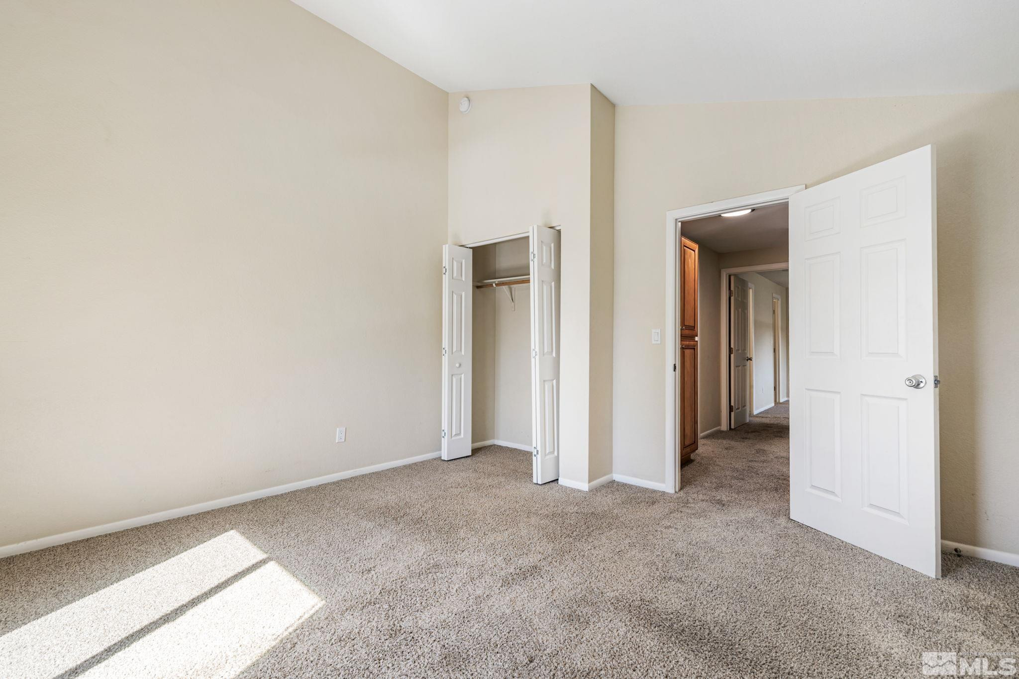 3924 Pheasant Drive Carson City, NV 89701 - Photo 34 of 38 an empty room with closet and a window