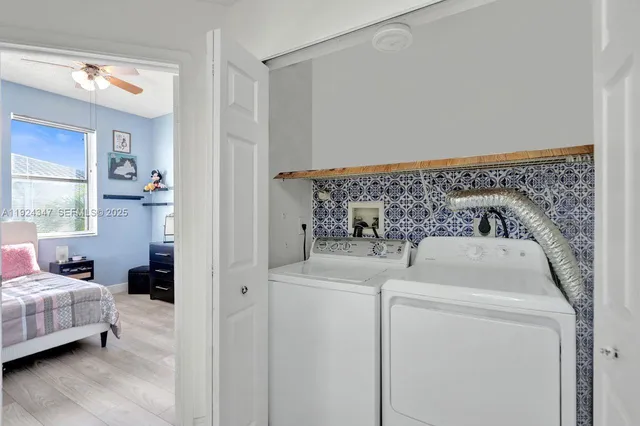 a utility room with dryer and washer