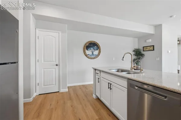 a spacious bathroom with a sink and a mirror
