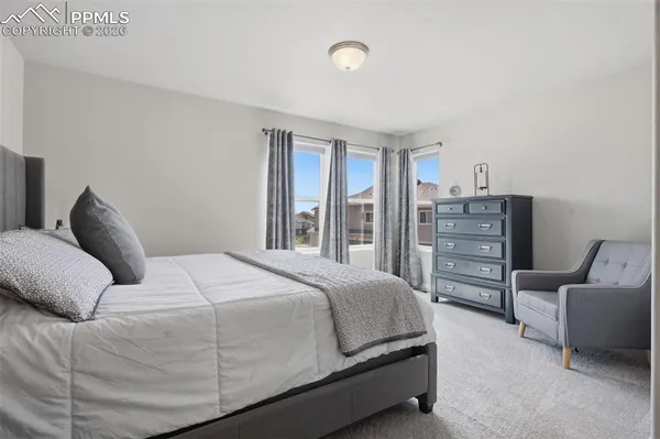 a bedroom with a bed and furniture