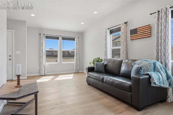a living room with furniture and a window