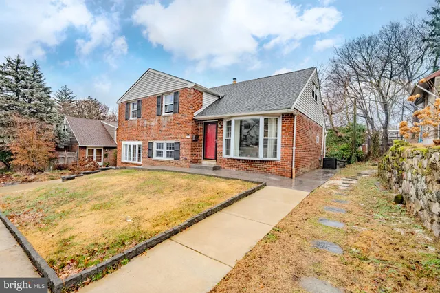 a house view with swimming pool and porch